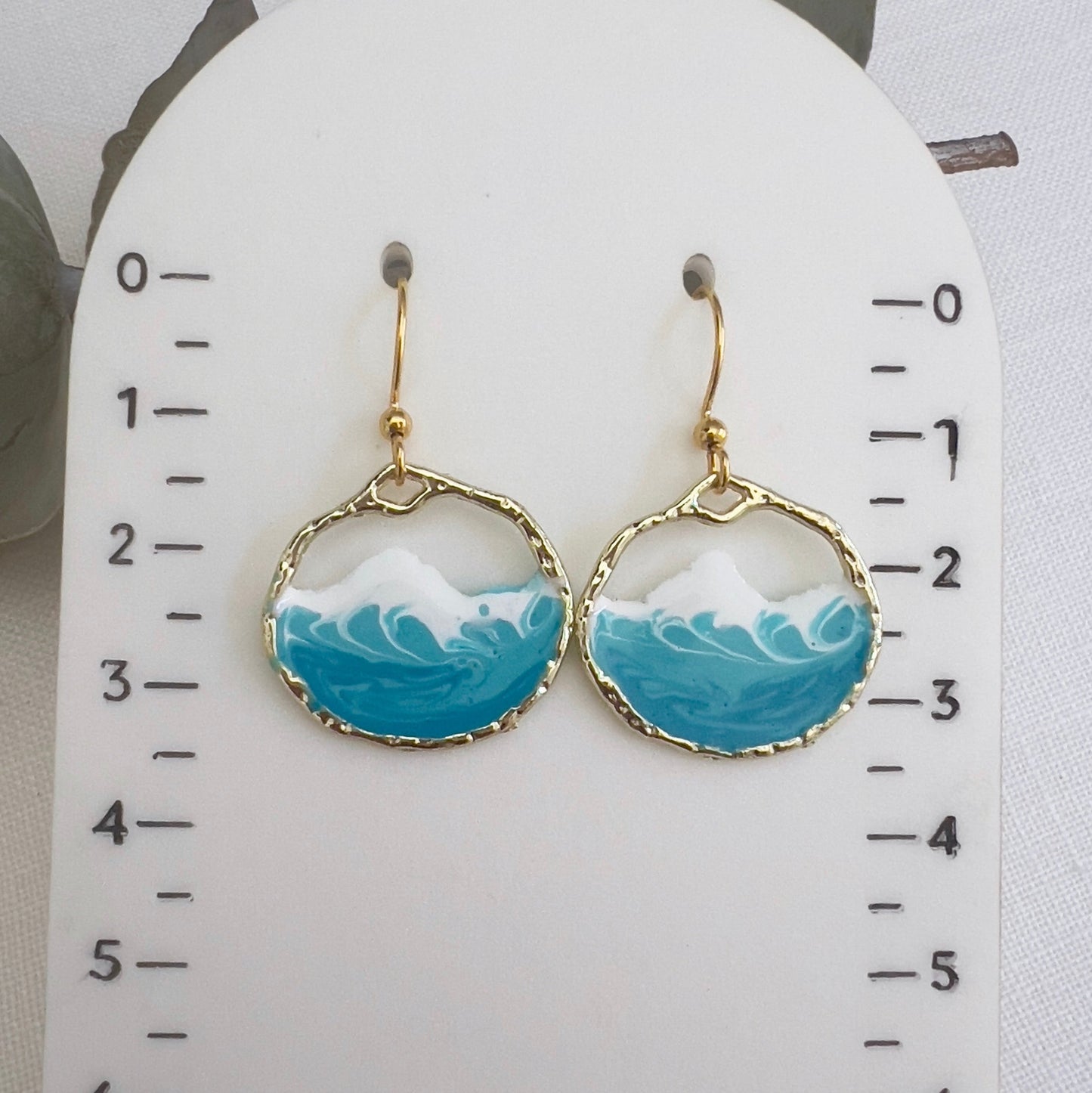 Round gold ocean wave earrings