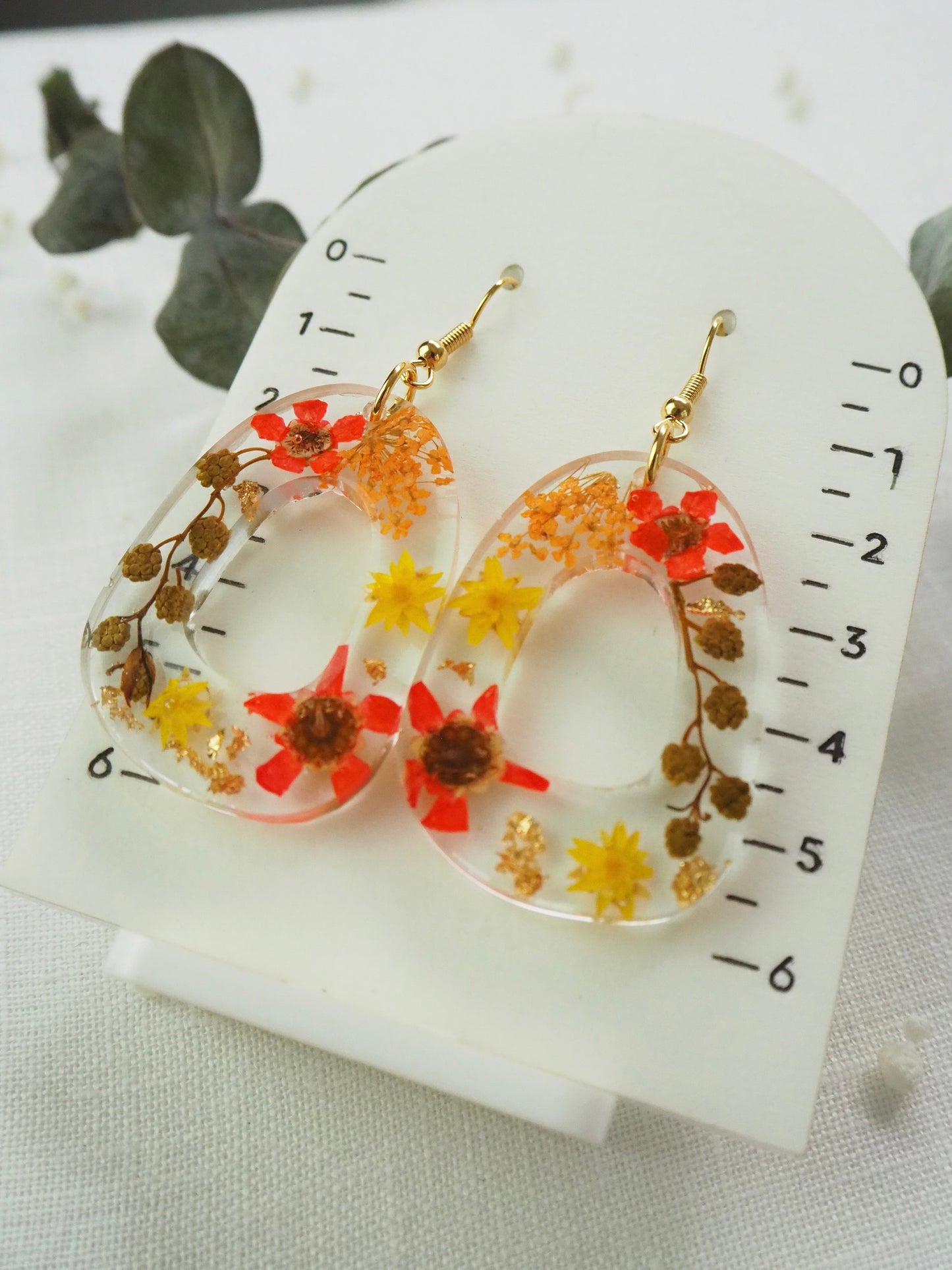 Vibrant orange floral earrings