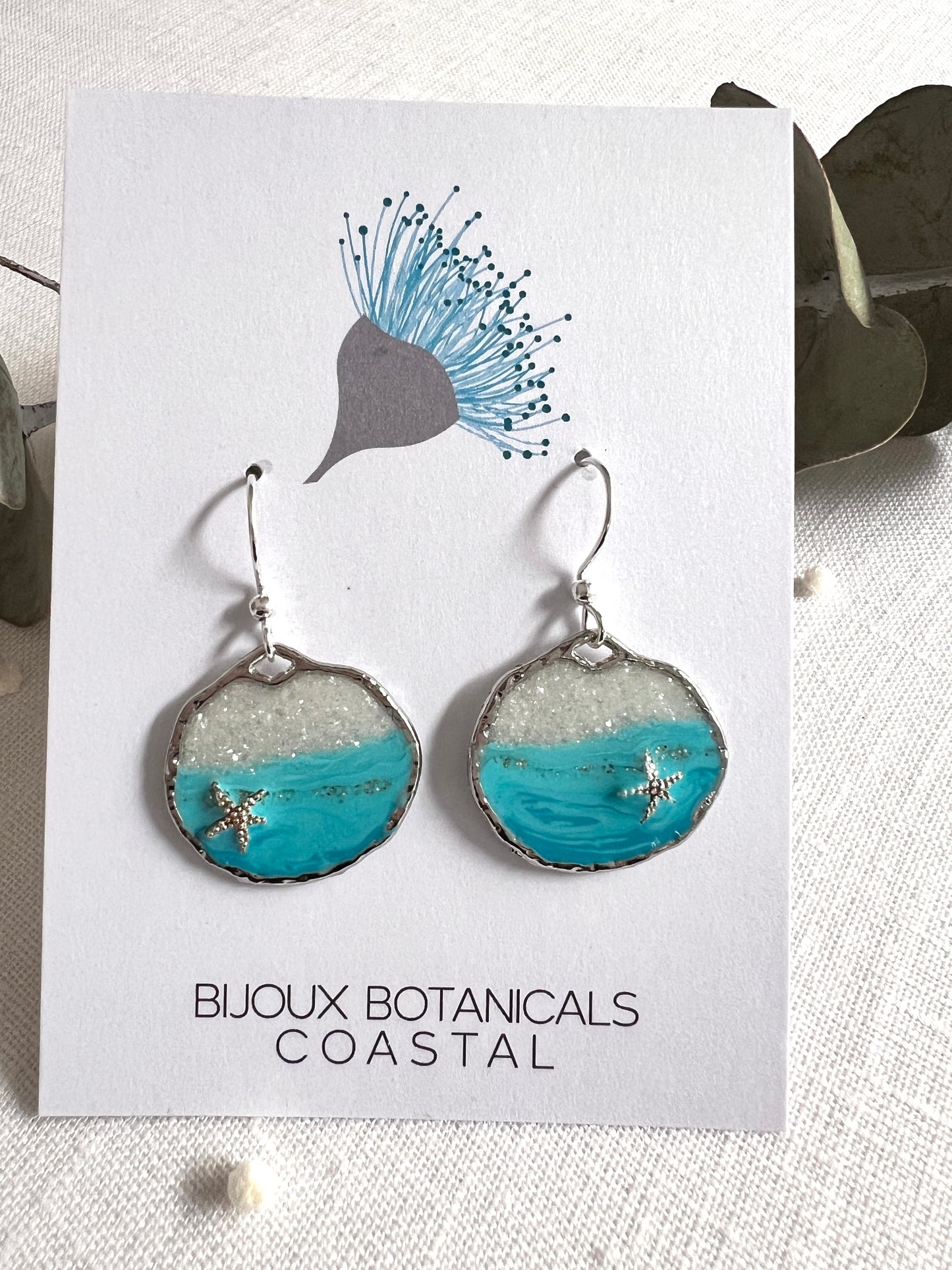 Round silver ocean starfish earrings