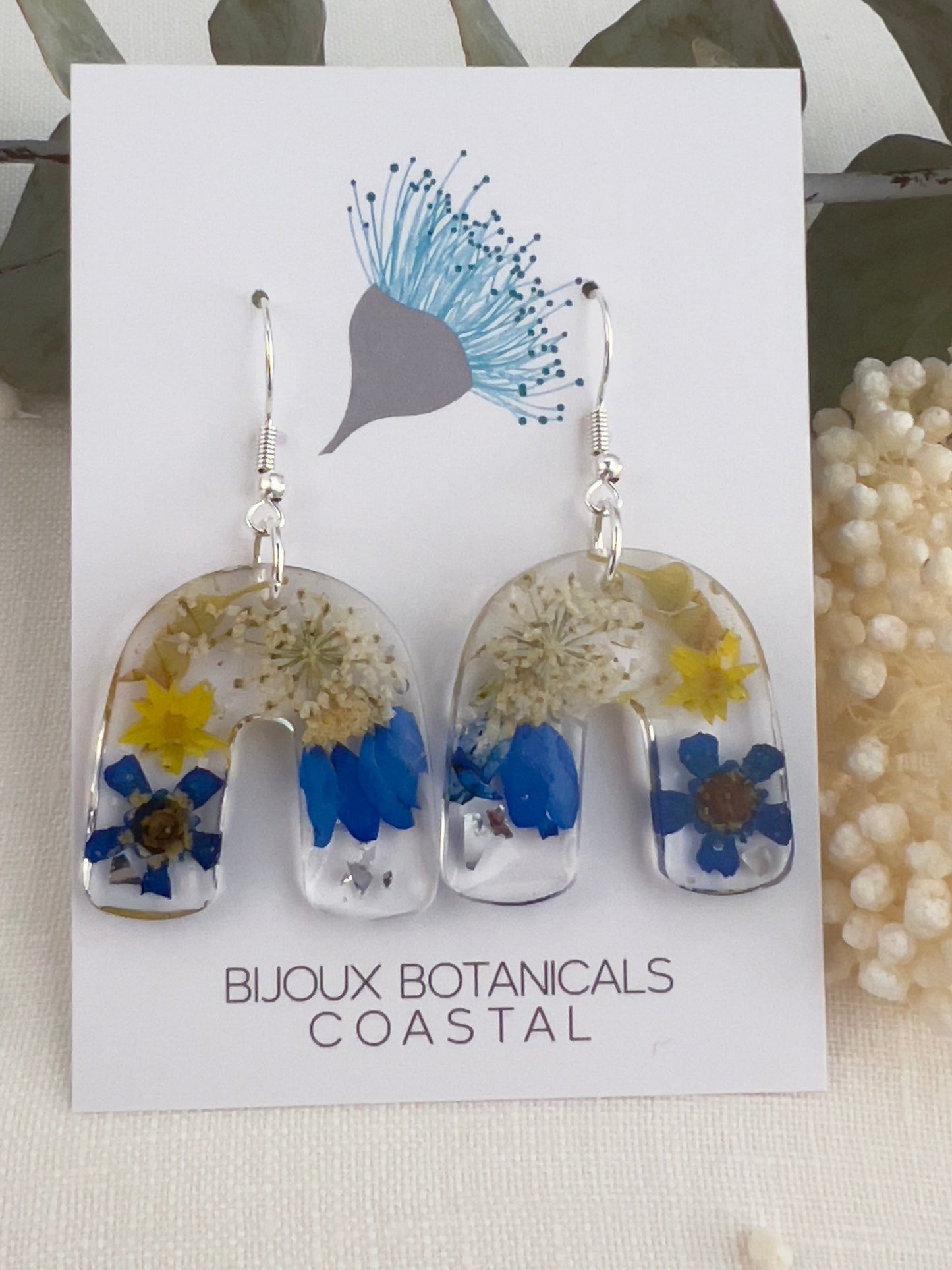 Vibrant blue floral arch earrings