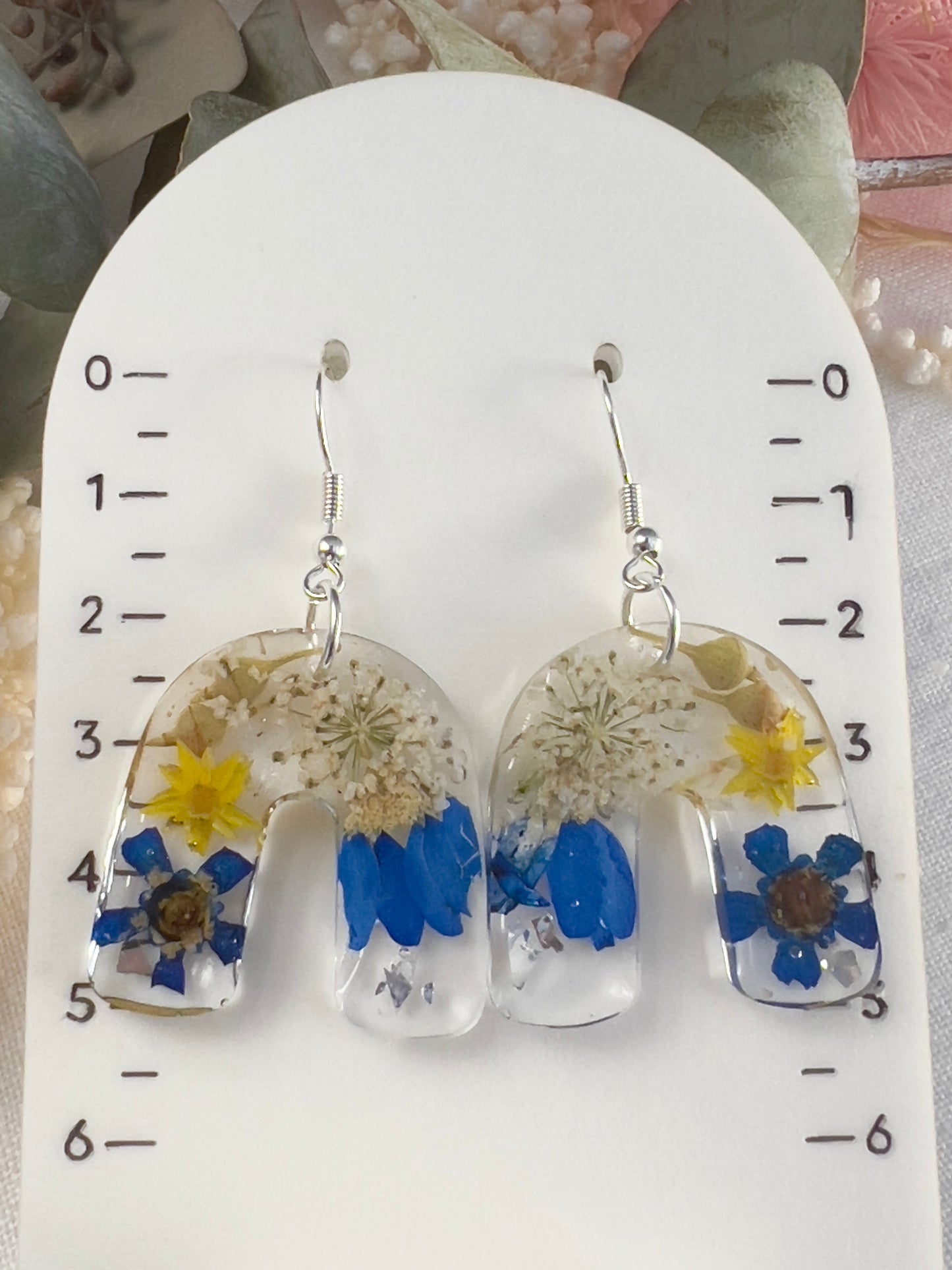 Vibrant blue floral arch earrings