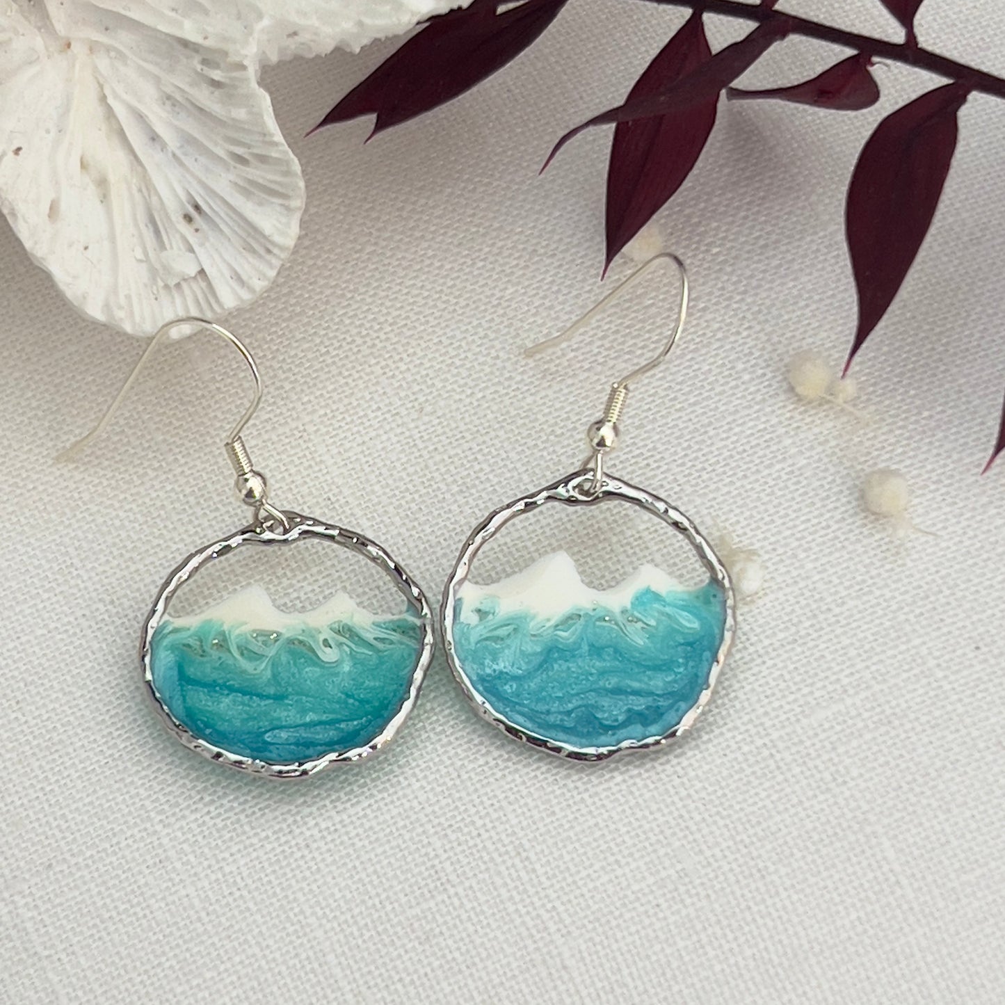 Round silver ocean wave earrings