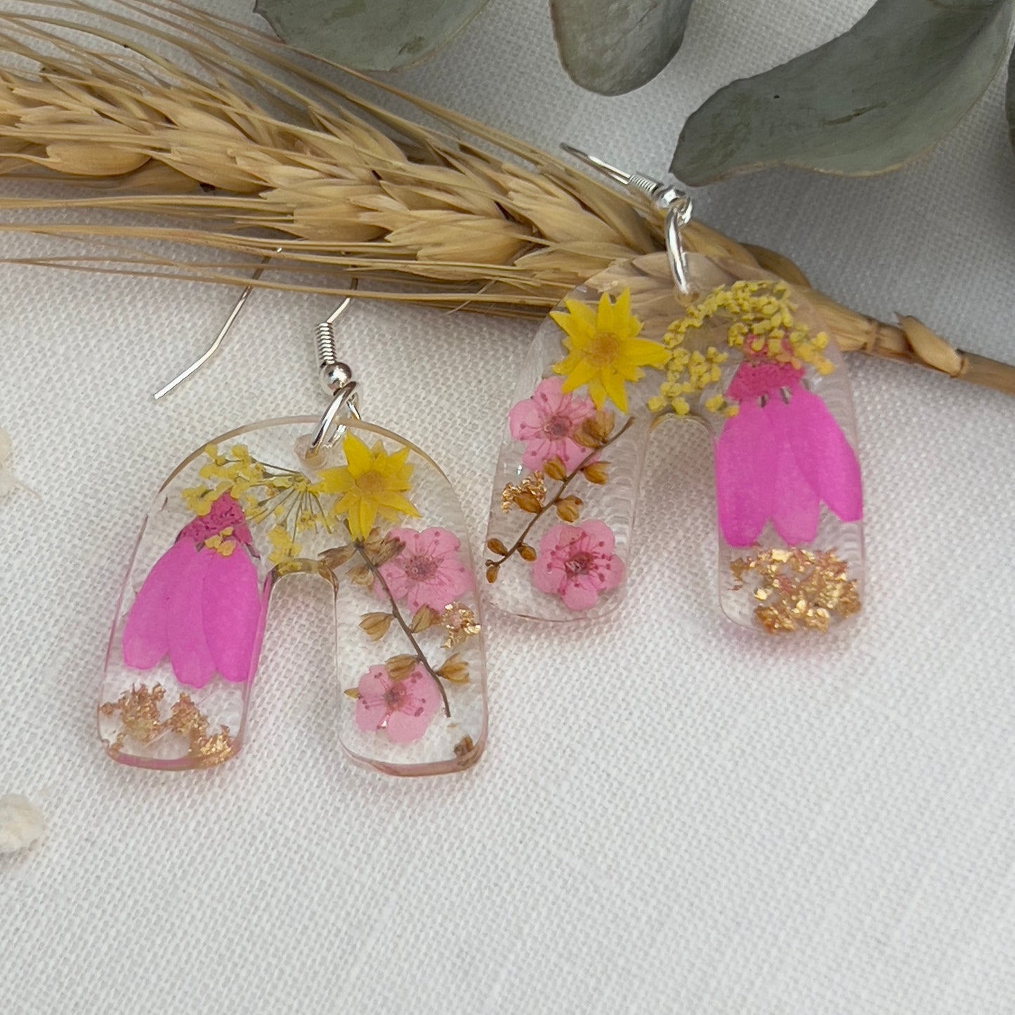 Vibrant pink floral arch earrings