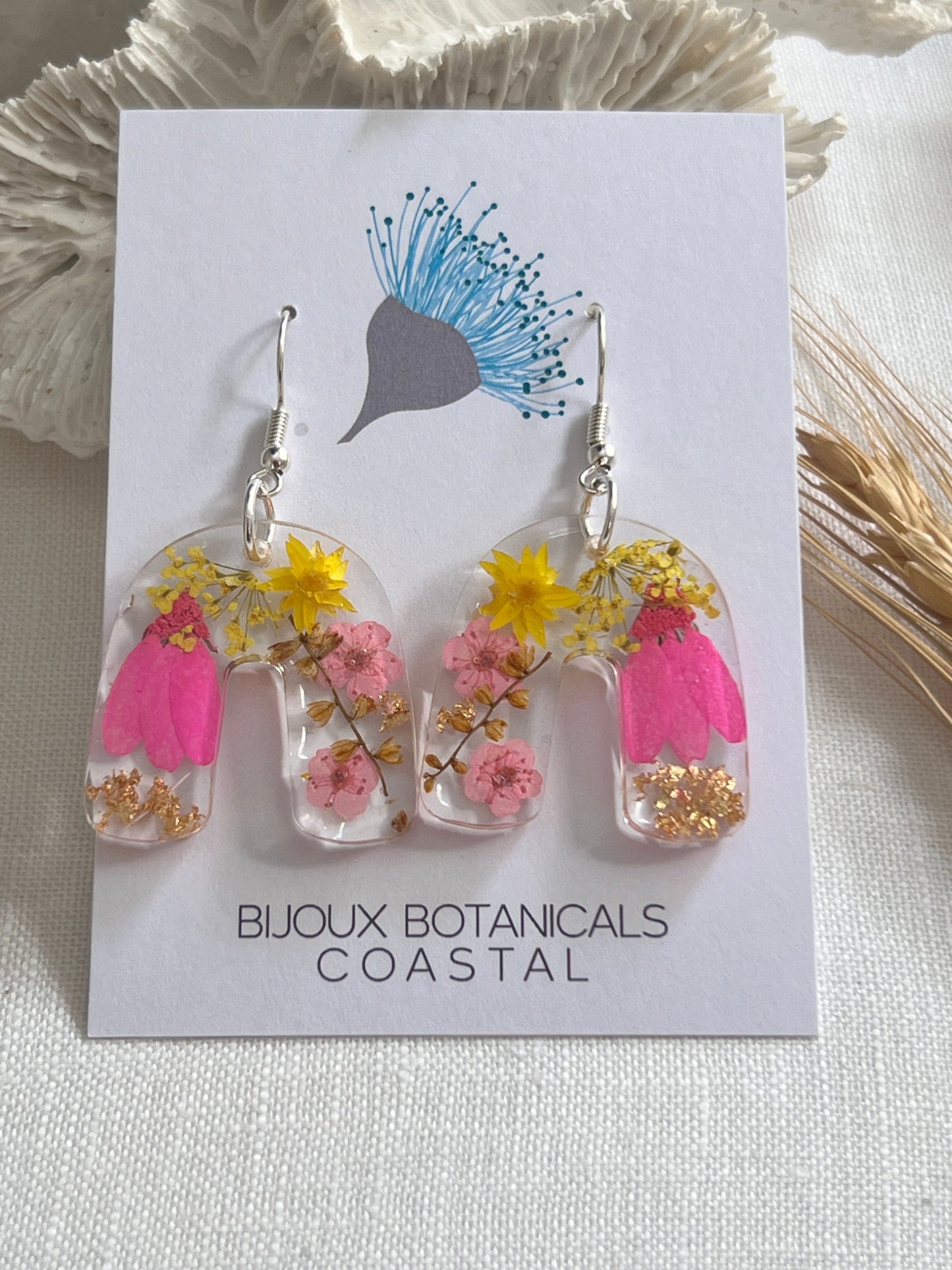 Vibrant pink floral arch earrings