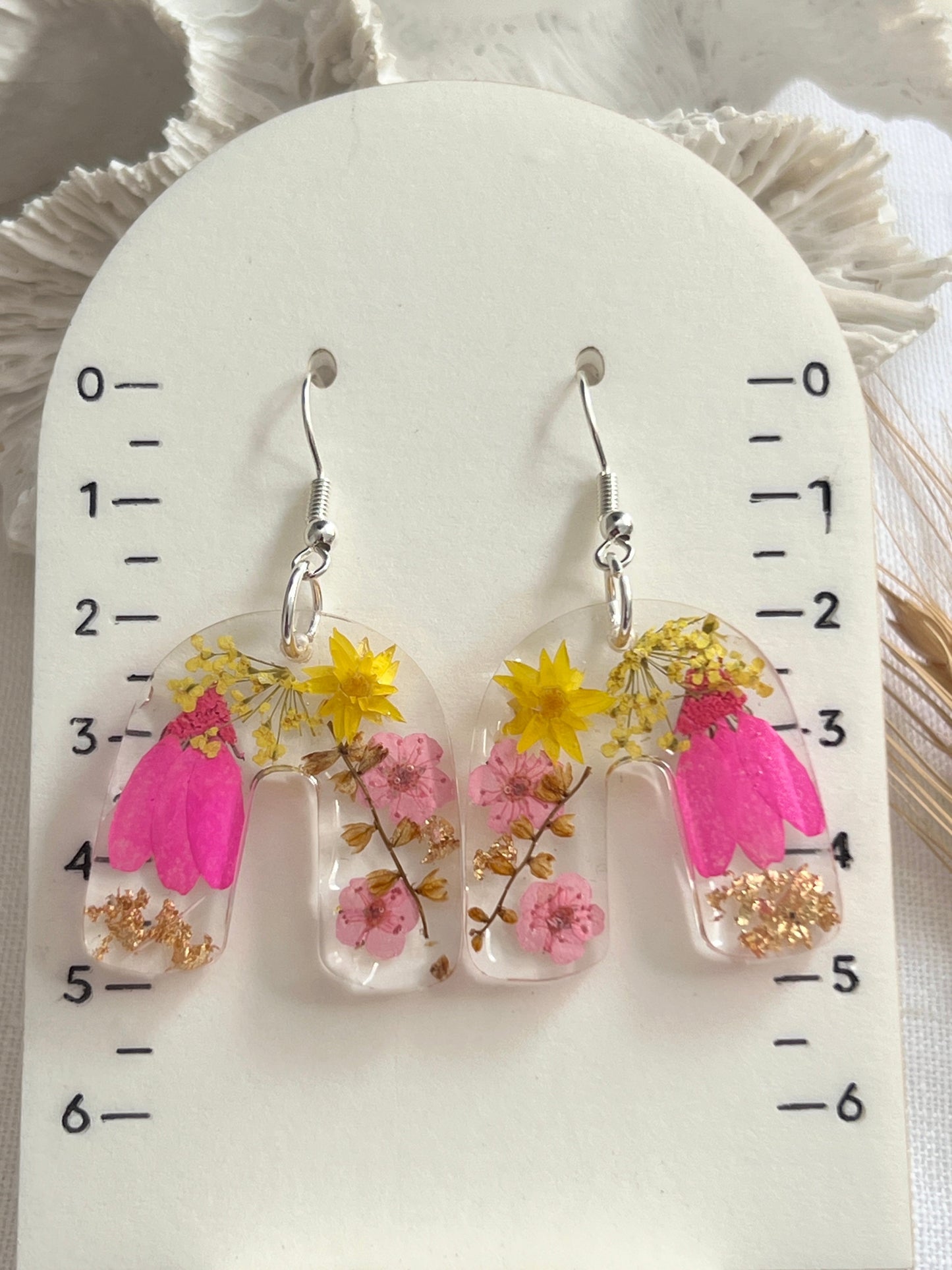 Vibrant pink floral arch earrings