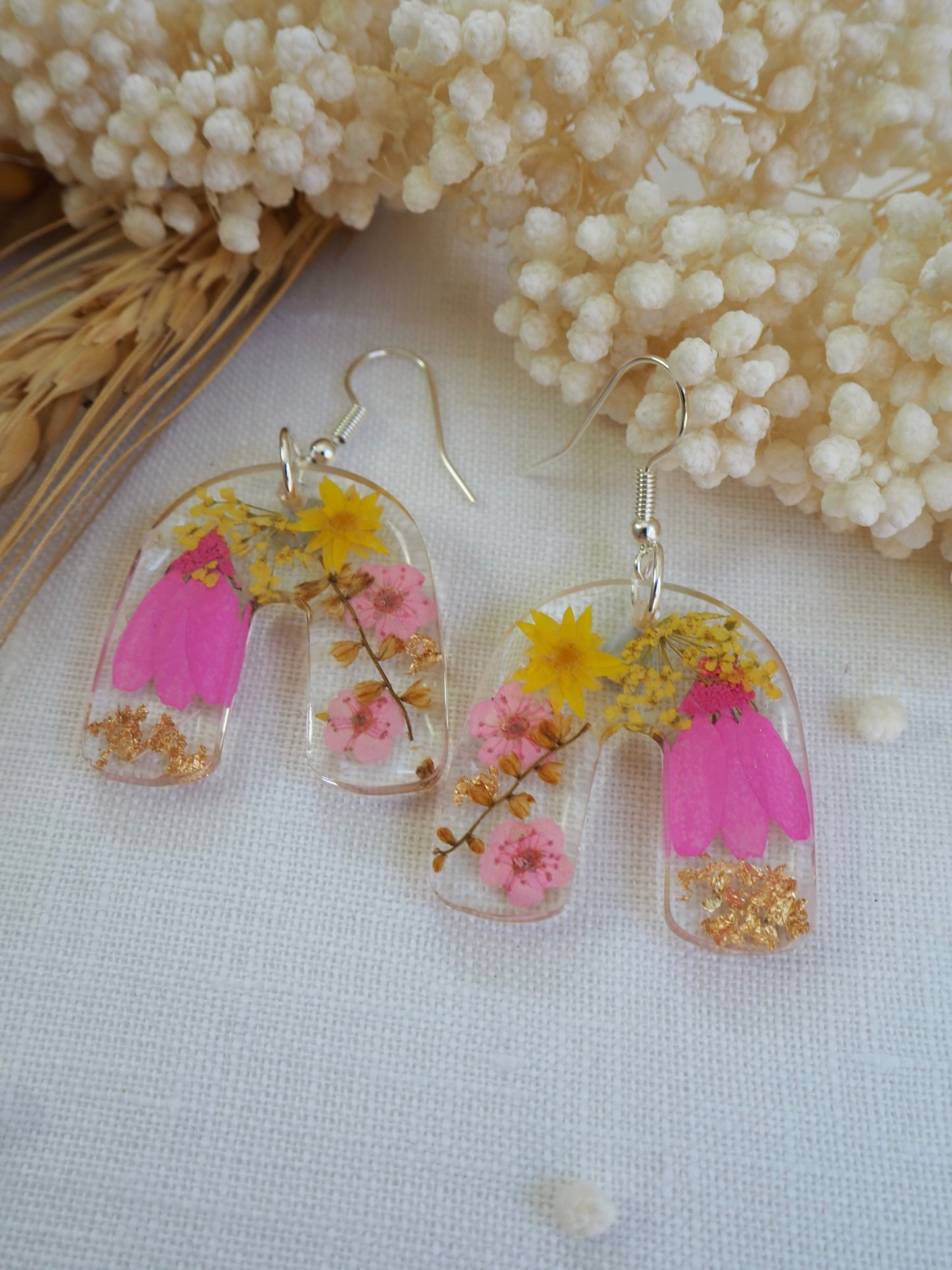 Vibrant pink floral arch earrings