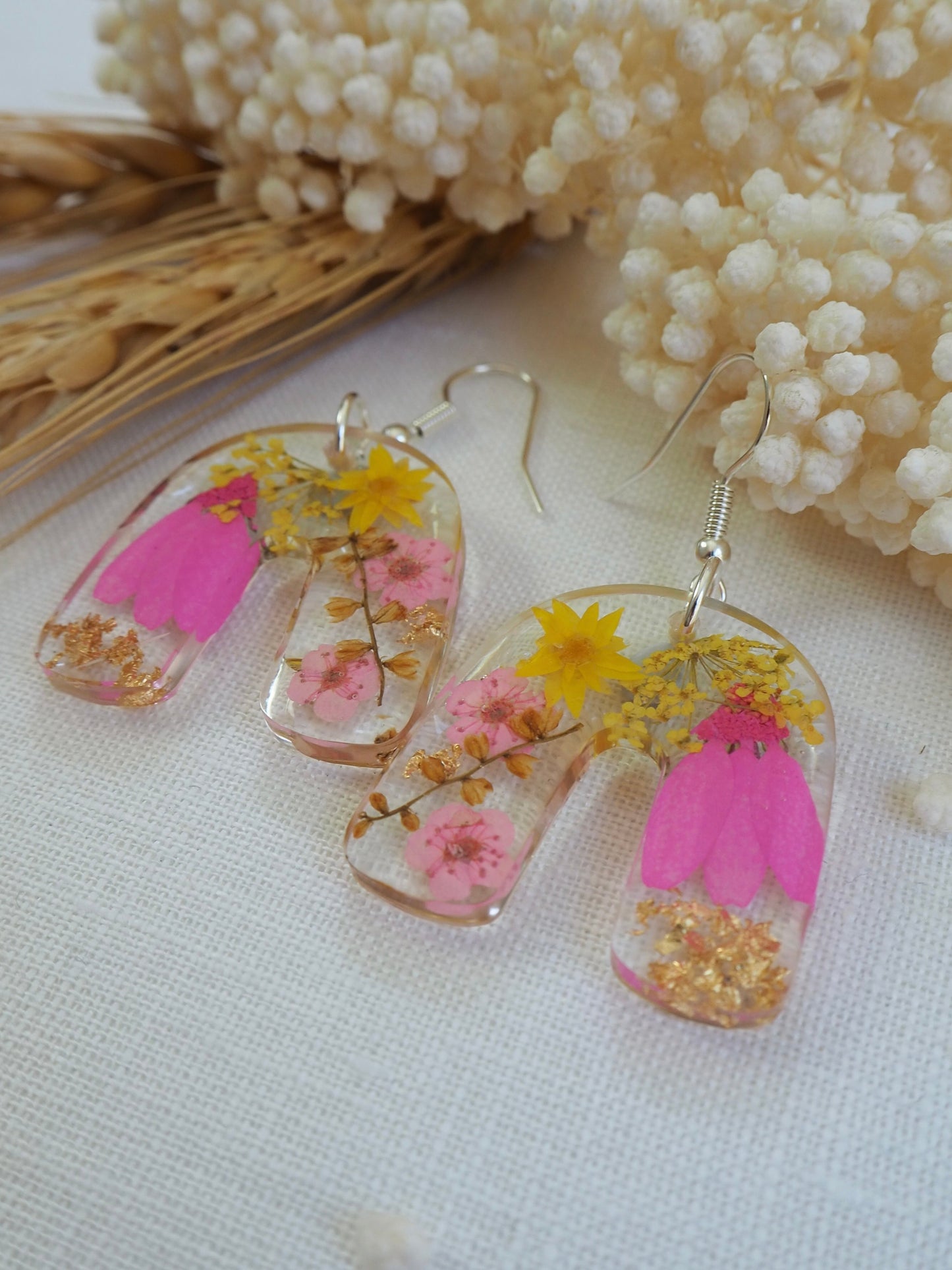 Vibrant pink floral arch earrings