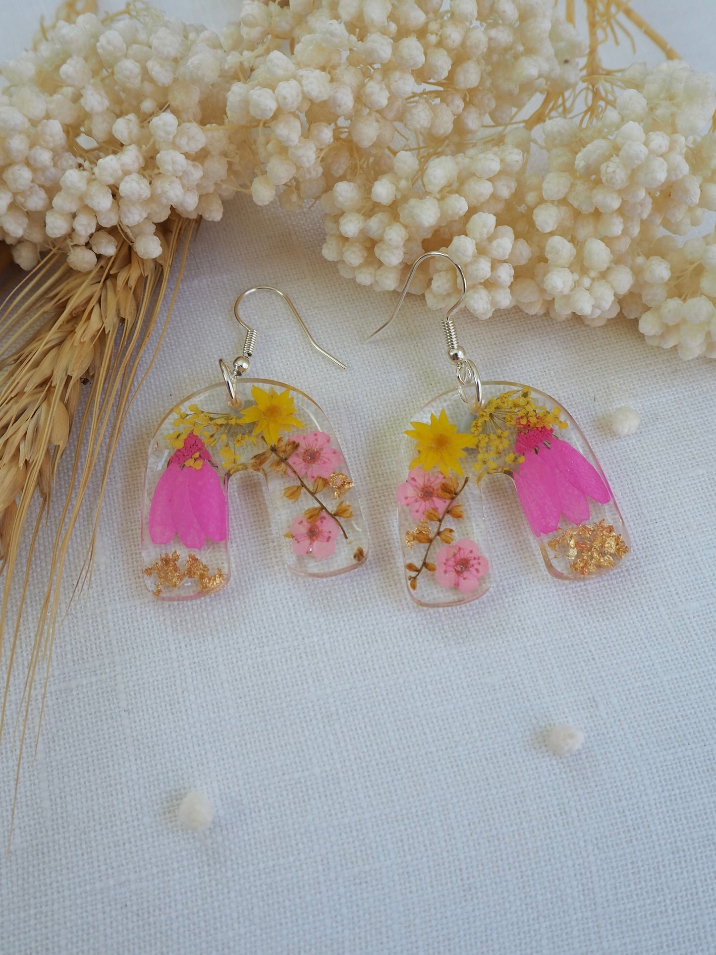 Vibrant pink floral arch earrings