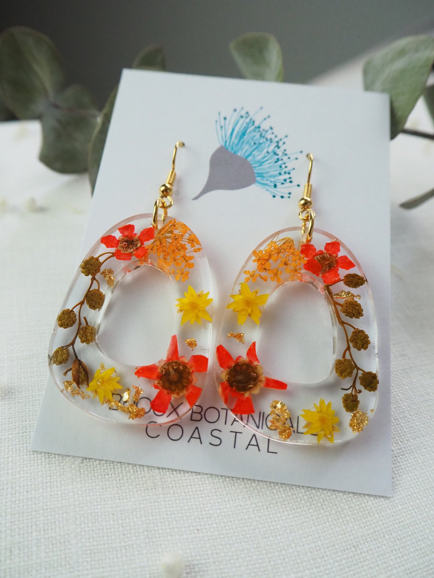 Vibrant orange floral earrings