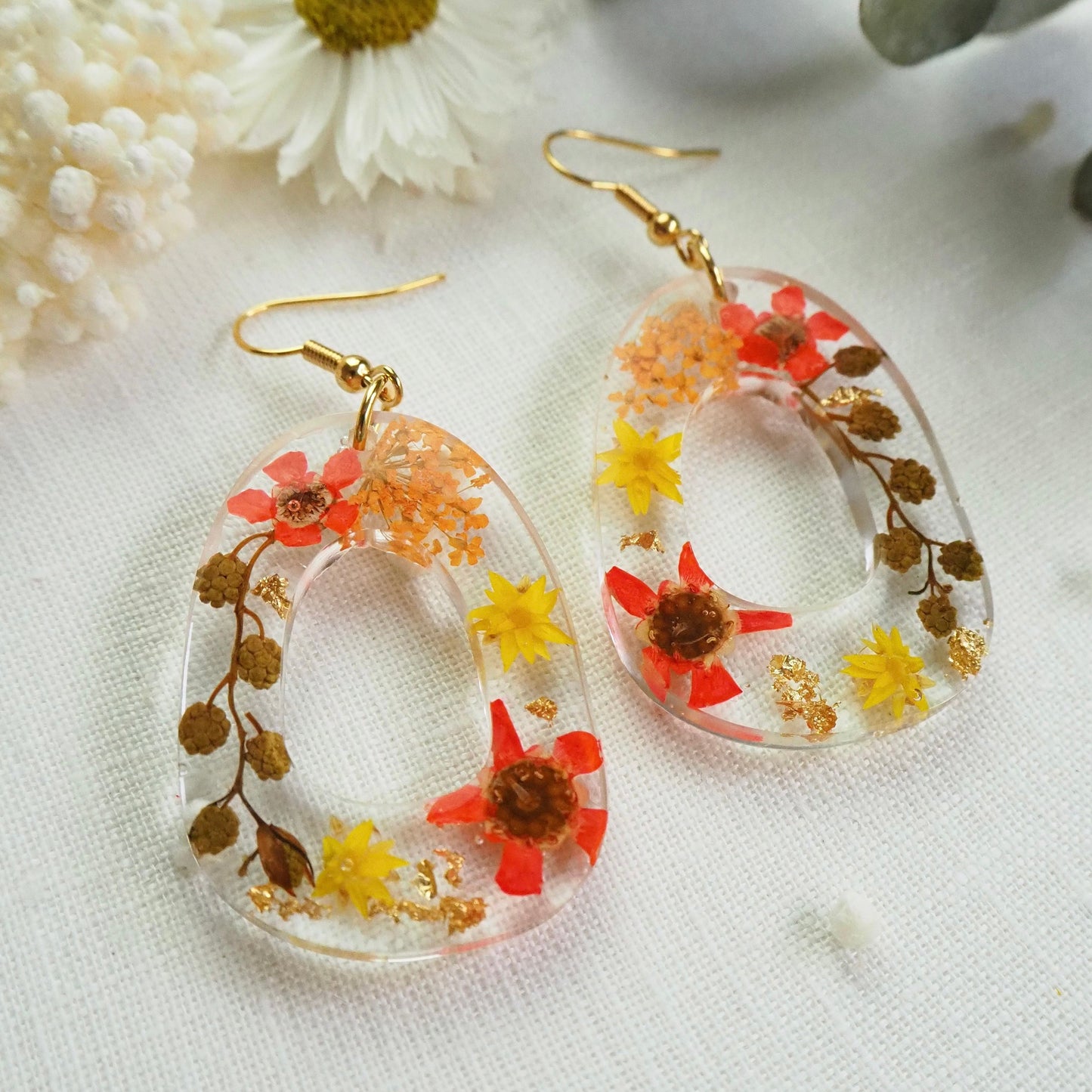 Vibrant orange floral earrings